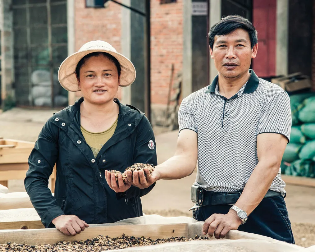 Hu XiXiang (right) and his wife, Li Guang Qiong.