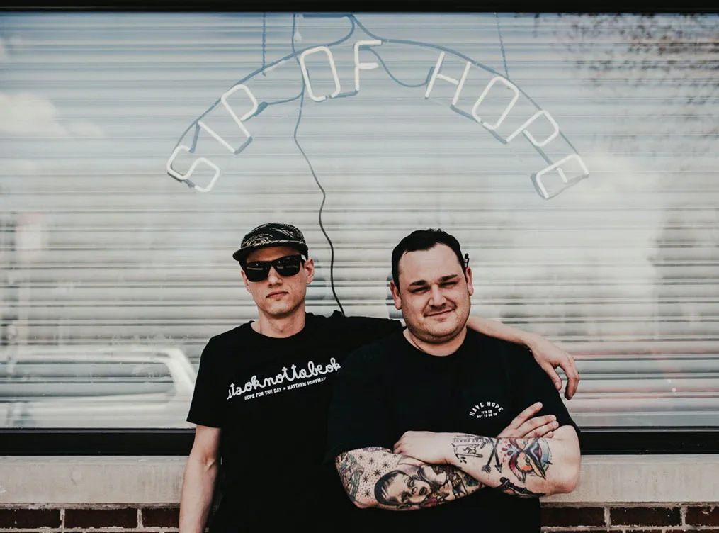 Sip of Hope Coffee Bar founder Jonny Boucher (right) with manager Brian Kmiecik.