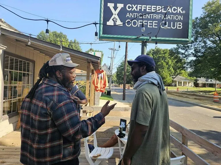 Jones (left) and Satterfield outside of the Anti-Gentrification Cxffee Club in Memphis.