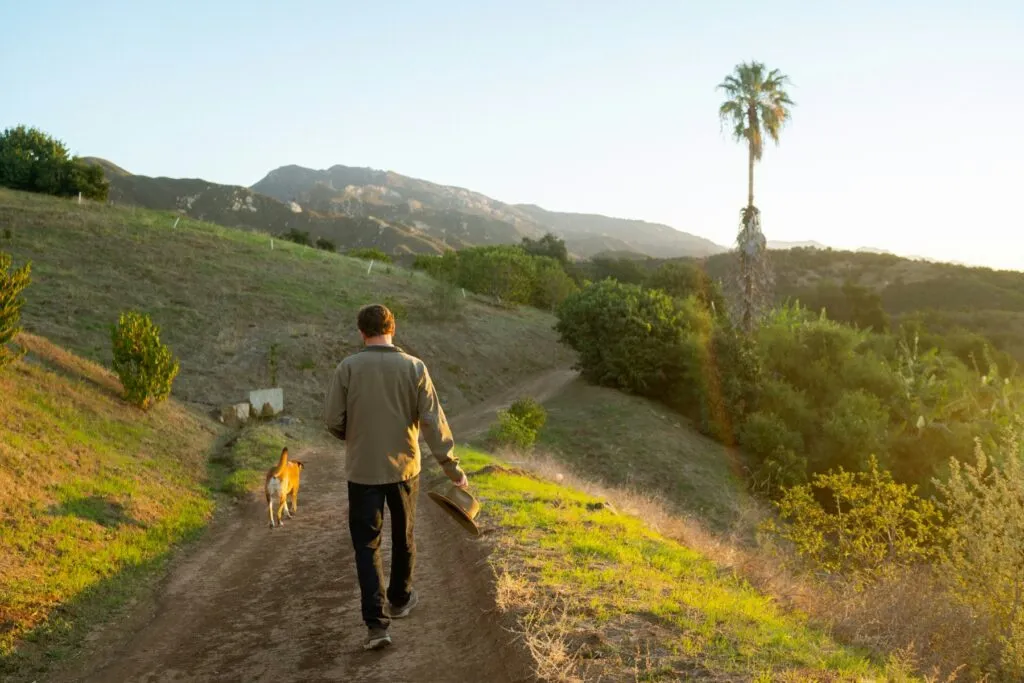 Jay Ruskey walks on one of his farms.