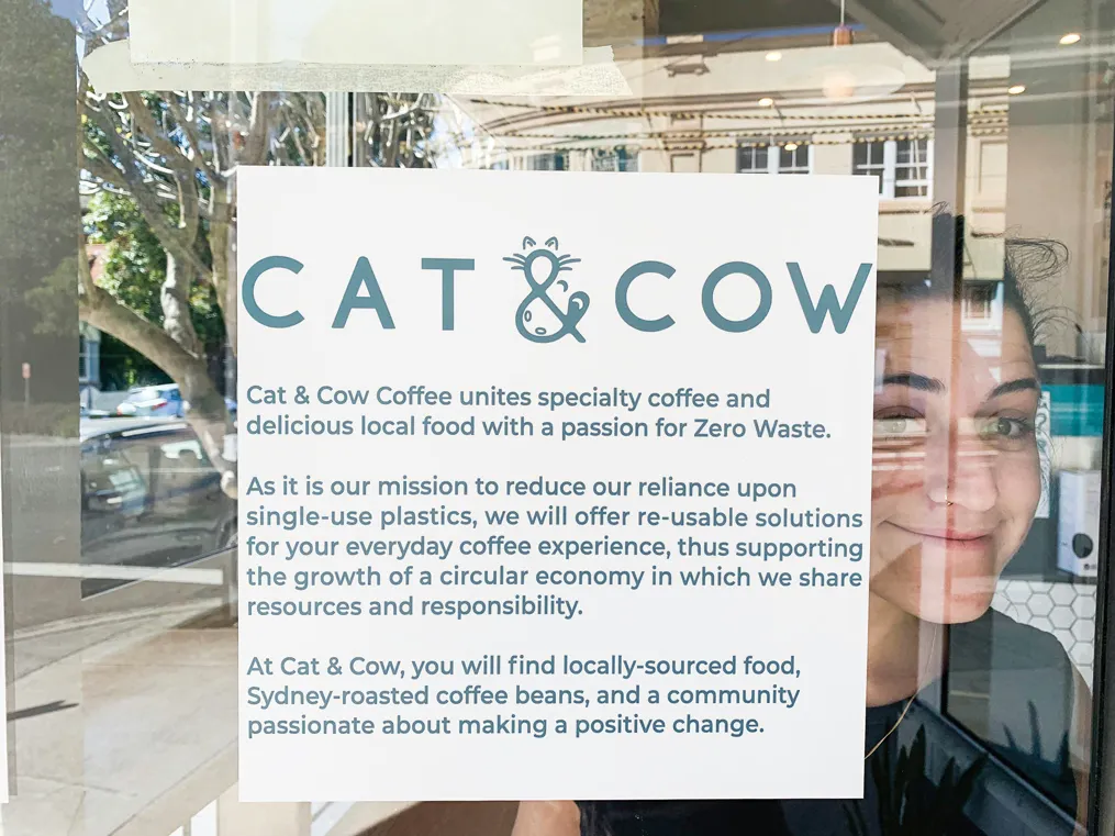 The team (above) and window sign at Cat & Cow