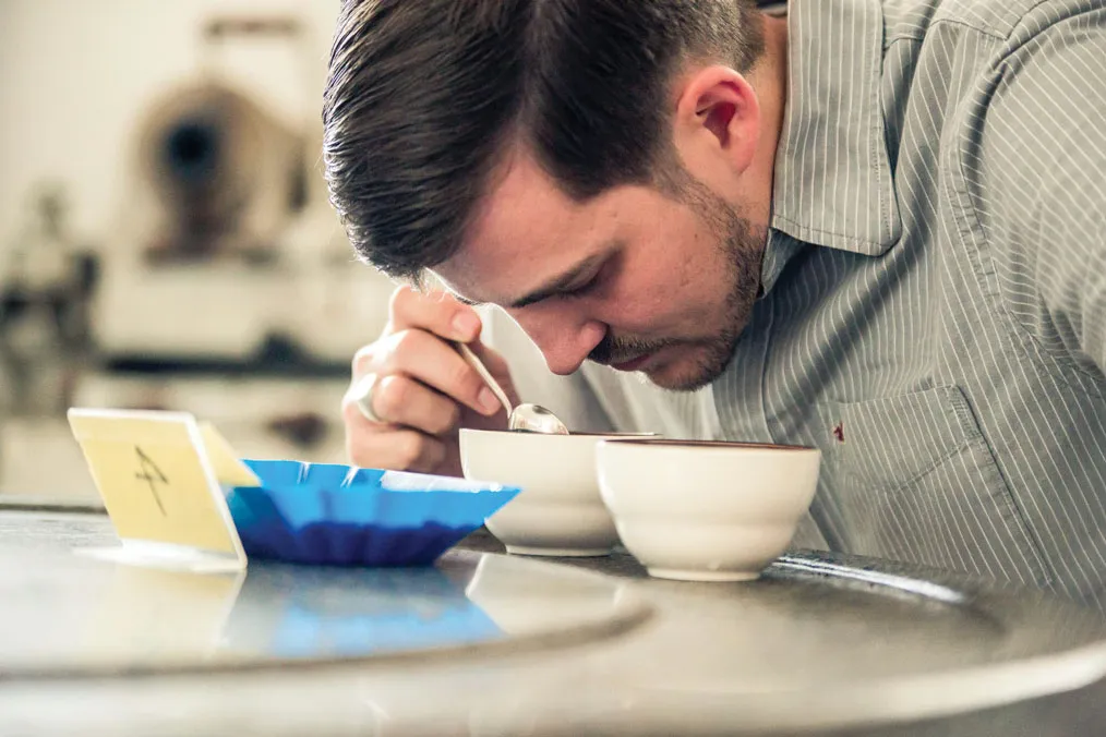 Tim Heinze cups coffee in Yunnan.